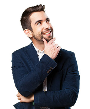 A man in a suit and tie is smiling